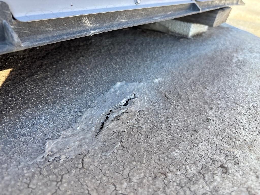 CS11 5 Before photo of cracked coating under rooftop mechanical equipment on the Mesa foam roof