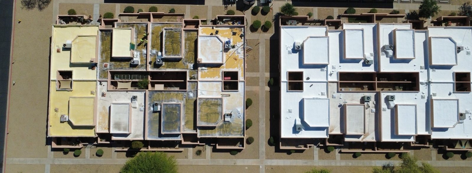 CS12 5 Aerial photo of two Peoria townhome buildings side by side, one with oxidized yellow foam awaiting work and one finished with new white foam and coating