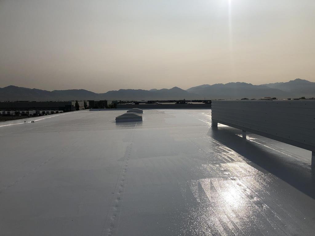 CS6 2 After photo of the completed white silicone roof coating system on a Salt Lake City commercial office building