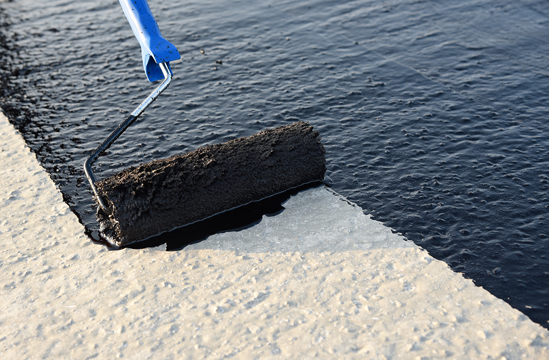 Worker Applies Bitumen Mastic On The Foundation