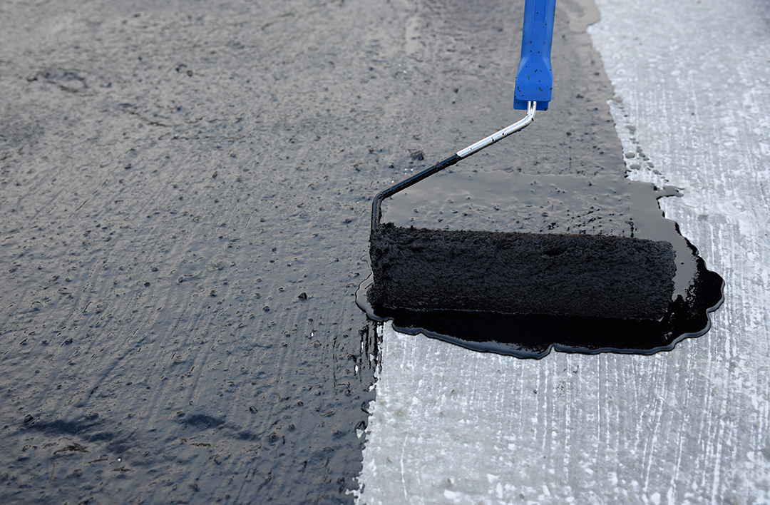 Worker Applies Bitumen Mastic On The Foundation
