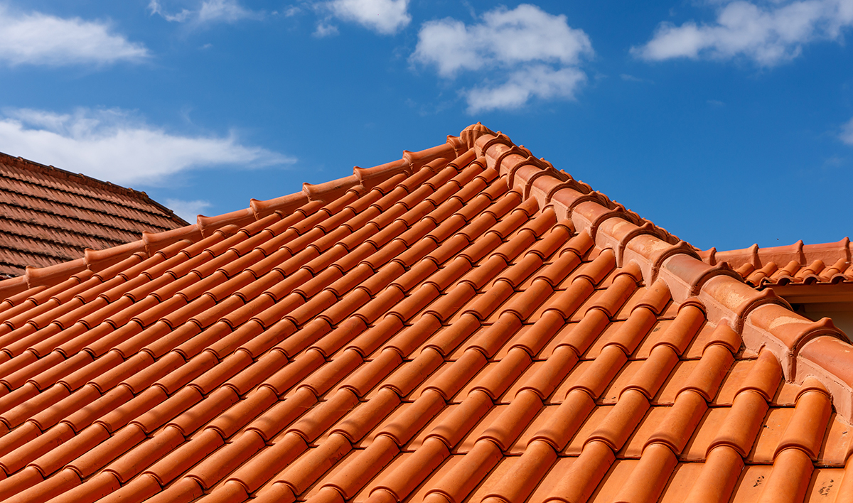 Red Tiles Panels Roof Under Blue Sky