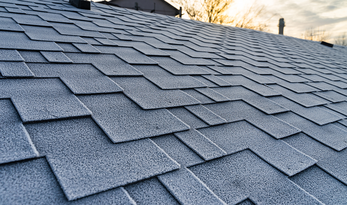 Winter Frost On The Asphalt Roofing Shingles