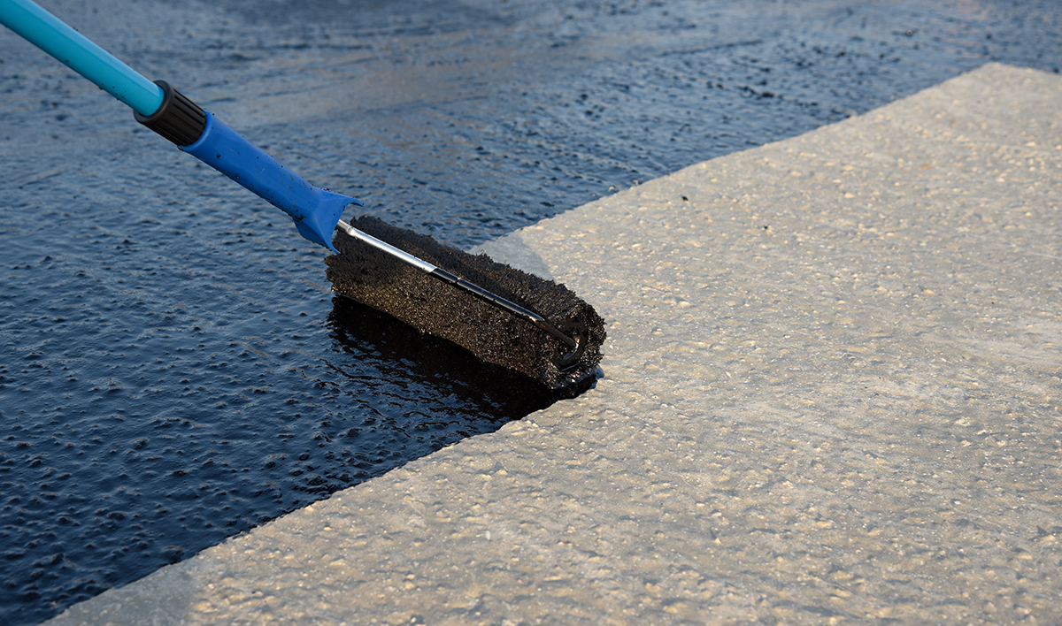 Worker Applies Bitumen Mastic On The Foundation