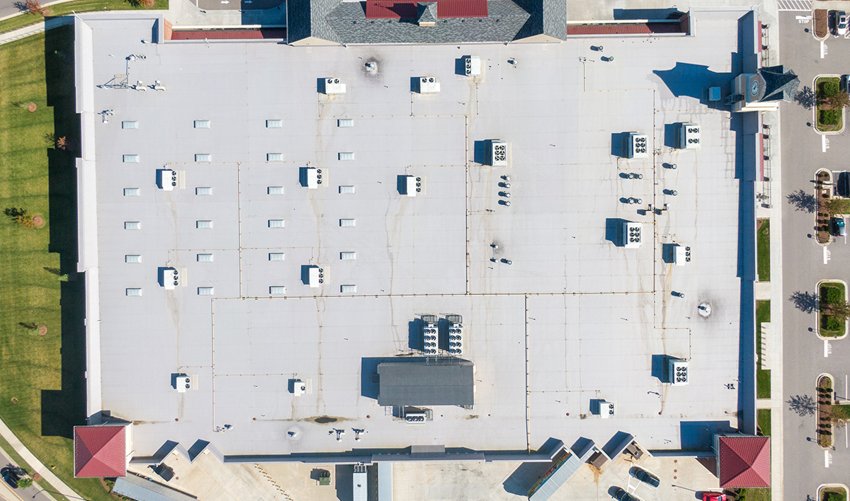 Drone Images Of TPO Flat Commercial Roof With Metal Panels: New