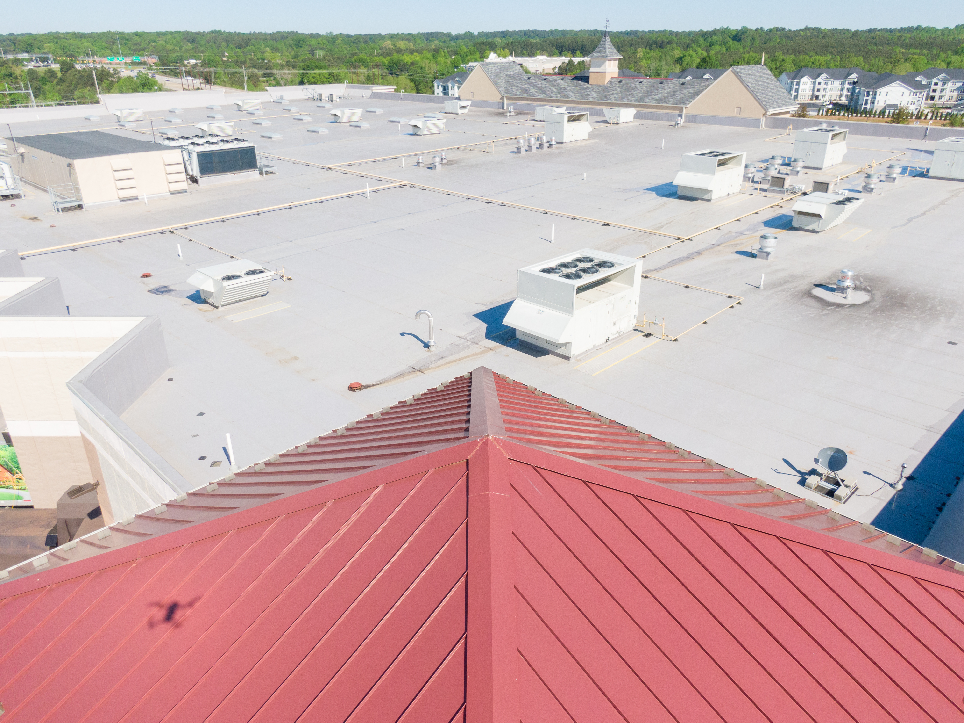 Drone Images Of TPO Flat Commercial Roof With Metal Panels: New & Existing Construction