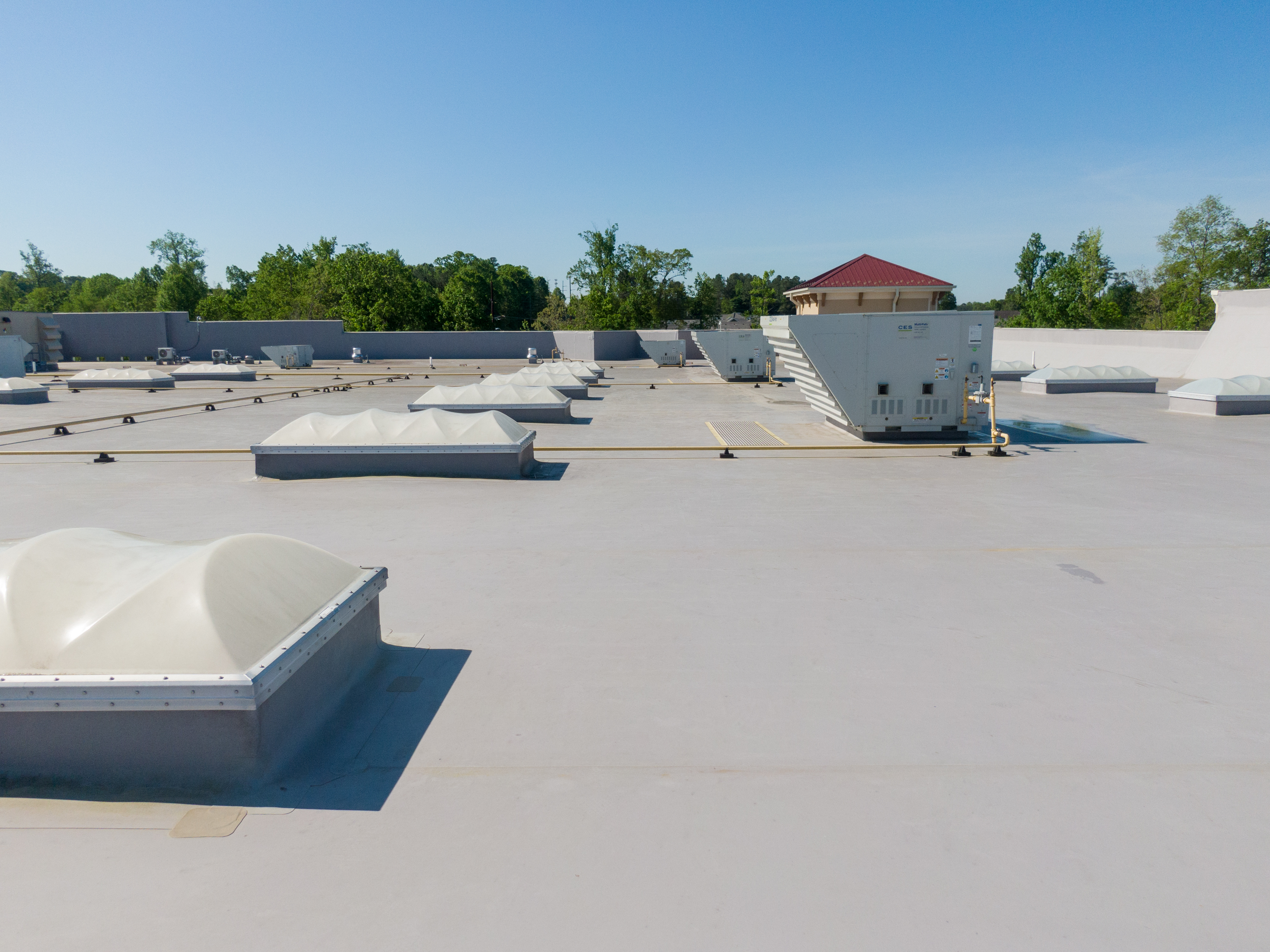 Drone Images Of TPO Flat Commercial Roof With Metal Panels: New & Existing Construction